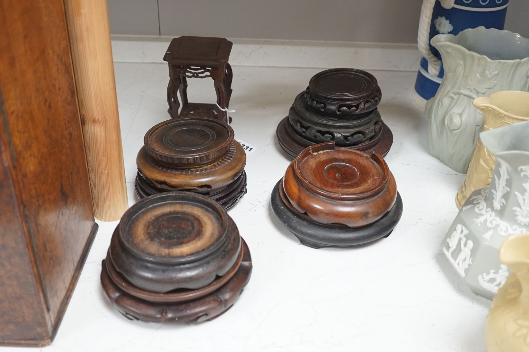 A group of 17 Chinese or Oriental hardwood stands